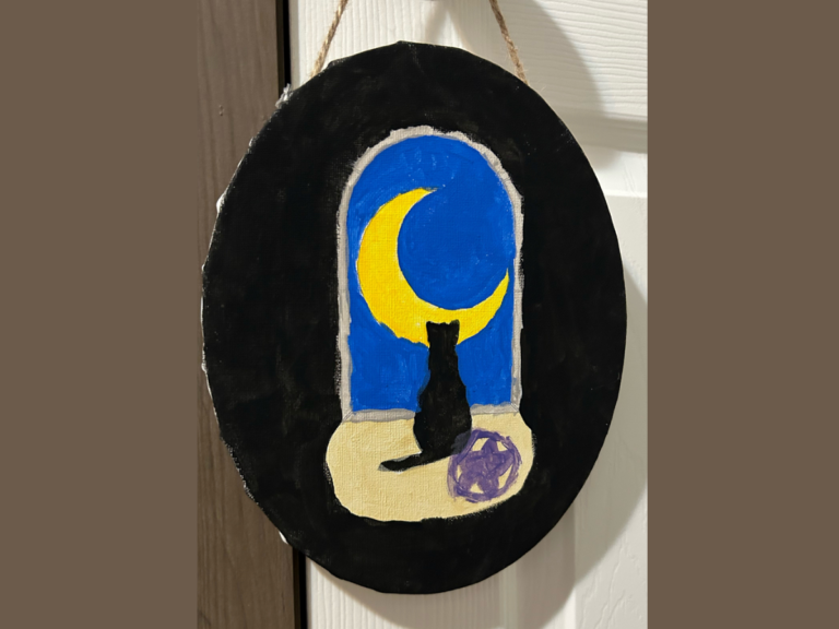 oval door hangar with a black background a bright blue open door with a yellow moon inside, and a black cat sitting and staring out the door
